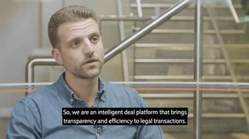 screenshot of person speaking with closed caption text visible