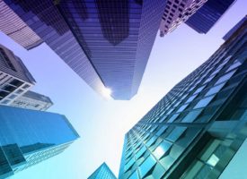 A view of skyscrapers looking straight up